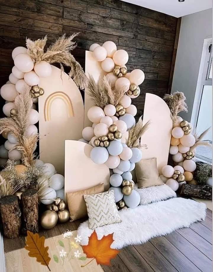 Neutral balloon arch with pampas grass and arched backdrop panels