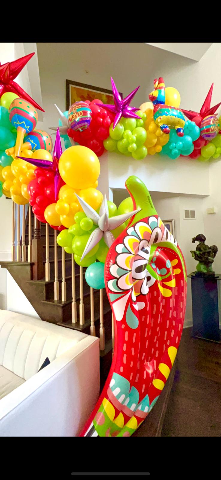 Colorful tropical balloon arrangement for a party table