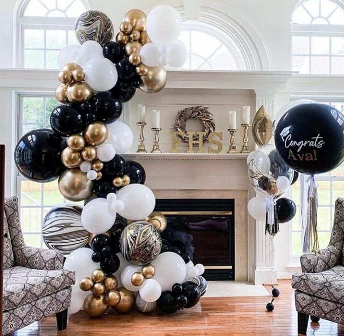 Black, white and gold balloon columns for a graduation