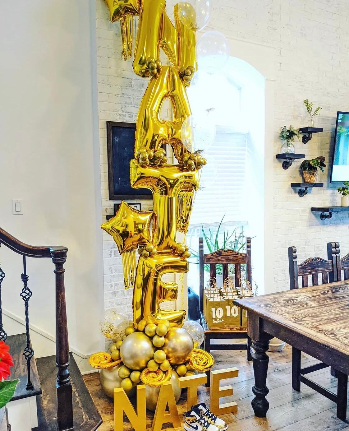 Gold graduation balloon column with custom lettering