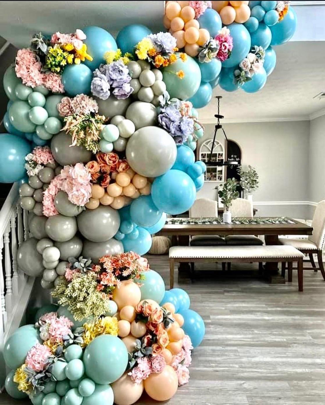 Pastel balloon installation framing a baby celebration